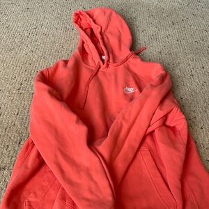 coral nike hoodie. size women’s L